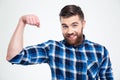 Portrait of a handsome man showing his muscles Royalty Free Stock Photo