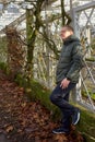 Portrait of handsome man standing outside in autumn weather. Calm Man Outdoors Relaxing And Breathing In Deeply In Royalty Free Stock Photo