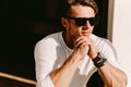 Portrait of a handsome man in sunglasses and watch outdoors Royalty Free Stock Photo