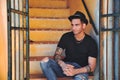 Portrait of handsome man sitting on cement stairs Royalty Free Stock Photo