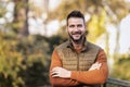 Smiling man standing outside in autumn weather Royalty Free Stock Photo