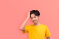 Friendly face man smile and self-confident positive expression on pink background studio shot