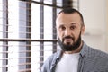 Portrait of handsome mature man near window indoors Royalty Free Stock Photo