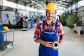 A portrait of handsome metal industry worker in factory