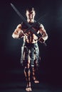 Severe barbarian in leather costume with sword Royalty Free Stock Photo