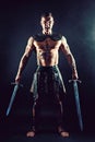 Severe barbarian in leather costume with sword Royalty Free Stock Photo