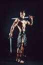 Severe barbarian in leather costume with sword Royalty Free Stock Photo