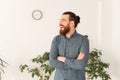 Portrait of handsome office worker standing with crossed arms and laughing Royalty Free Stock Photo