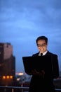 Handsome Persian businessman against view of the city at night Royalty Free Stock Photo