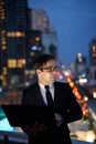 Handsome Persian businessman against view of the city at night Royalty Free Stock Photo