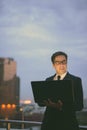 Handsome Persian businessman against view of the city at night Royalty Free Stock Photo