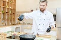 Handsome Chef Cooking in Restaurant Royalty Free Stock Photo