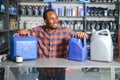 Portrait of a handsome african salesman in an auto parts store. The concept of car repair Royalty Free Stock Photo