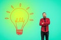 Portrait of handsome satisfied bearded businessman in red shirt standing with raised arms and and looking at camera and smiling Royalty Free Stock Photo