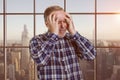 Portrait of a handsome senior mature male holds his head with both hands. Royalty Free Stock Photo