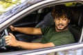 Portrait of an handsome smiling asian business man driving his car Royalty Free Stock Photo