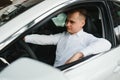 Portrait of an handsome smiling business man driving his car. Royalty Free Stock Photo