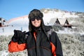 Portrait on a handsome smiling man on a ski slope background Royalty Free Stock Photo