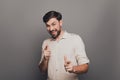 Portrait of handsome smiling young businessman pointing on camera Royalty Free Stock Photo