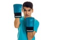 Portrait of handsome sportsman in blue gloves and uniform practicing boxing on camera isolated on white background Royalty Free Stock Photo