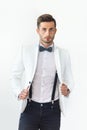 Portrait of handsome stylish man in white elegant suit Royalty Free Stock Photo