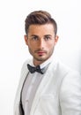 Portrait of handsome stylish man in white elegant suit Royalty Free Stock Photo