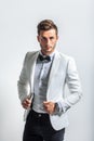 Portrait of handsome stylish man in white elegant suit Royalty Free Stock Photo