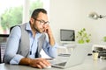 Portrait of handsome trendy casual mid age business man in office desk with laptop computer Royalty Free Stock Photo