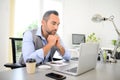 Portrait of handsome trendy casual mid age business man in office desk with laptop computer Royalty Free Stock Photo