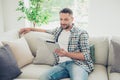 Portrait of handsome trendy stylish guy work worker hold hand modern technology look read novelty checkered shirt jeans Royalty Free Stock Photo