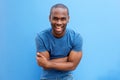 Handsome young african american man laughing with arms crossed Royalty Free Stock Photo