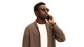 Portrait of handsome young african man calling on smartphone isolated on white background Royalty Free Stock Photo