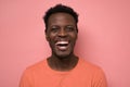 Portrait of a handsome young african man laughing on joke Royalty Free Stock Photo