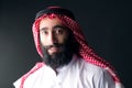 Portrait of a handsome young arabian man with a bushy beard