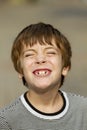 Portrait of handsome young boy smiling and showing his teeth Royalty Free Stock Photo