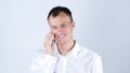 Portrait of a handsome young business man on cell phone getting good news Royalty Free Stock Photo