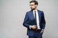 Portrait of a handsome young business man holding document folder Royalty Free Stock Photo