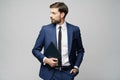 Portrait of a handsome young business man holding document folder Royalty Free Stock Photo