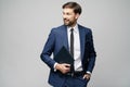 Portrait of a handsome young business man holding document folder Royalty Free Stock Photo