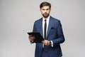 Portrait of a handsome young business man holding folder Royalty Free Stock Photo