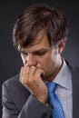 Portrait of handsome young business man thinking Royalty Free Stock Photo