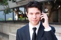 Portrait of handsome, young business man using cell Royalty Free Stock Photo