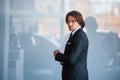 Portrait of handsome young businessman in black suit and tie Royalty Free Stock Photo
