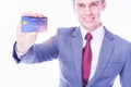 Portrait handsome young businessman showing credit card. Executive guy wear suit. English young man or customer get satisfied cred