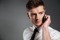 Portrait of a handsome young businessman talking on mobile phone Royalty Free Stock Photo