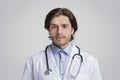 Portrait Of Handsome Young Doctor Wearing Medical Coat And Stethoscope Royalty Free Stock Photo