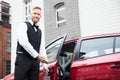 Male Valet Opening Car Door