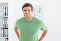 Portrait of a handsome young man with back pain Royalty Free Stock Photo