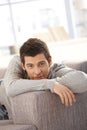 Portrait of handsome young man on couch