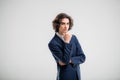 Portrait of a handsome young man in a dark blue business suit on a white background Royalty Free Stock Photo